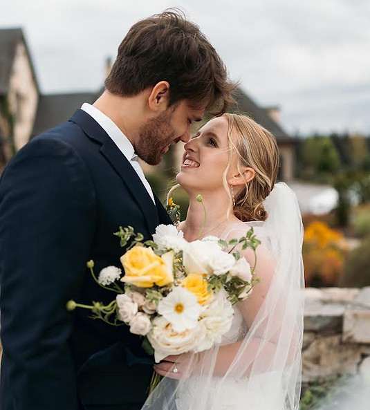 Wedding couple embracing at Chateau de Lis